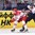 OSTRAVA, CZECH REPUBLIC - MAY 2: Denmark's Kirill Starkov #14 pulls the puck away from Slovakia's Ivan Svarny #23 during preliminary round action at the 2015 IIHF Ice Hockey World Championship. (Photo by Richard Wolowicz/HHOF-IIHF Images)

